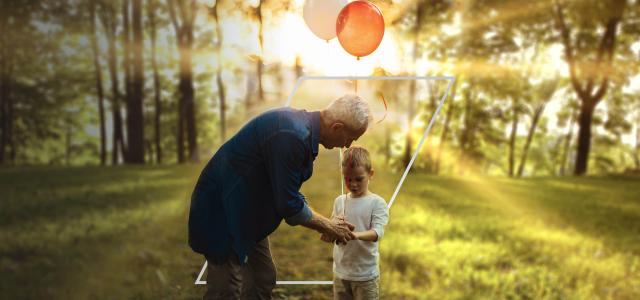 grandfather and grandson with balloon
